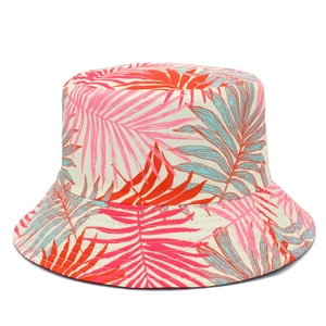 Detail of tropical palm leaf pattern on cream foldable canvas sun bucket hat