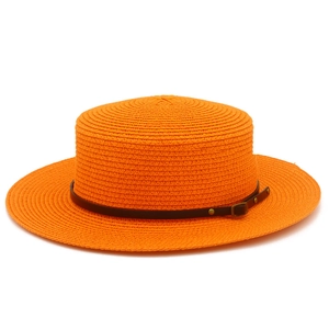 Detail of orange flat top straw hat with brown leather belt and gold buckle accent