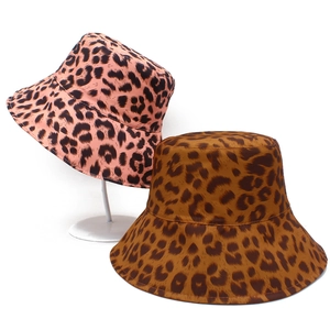 Two reversible leopard print sun hats in pink and tan, foldable wide brim cotton design