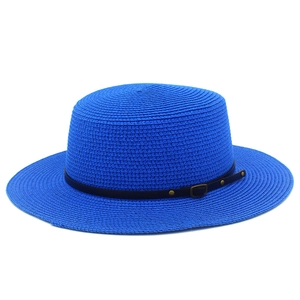 Detailed close-up of woven blue straw boater hat with black faux leather strap and buckle