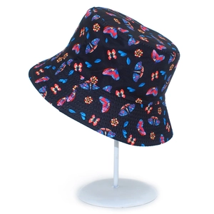 Reversible bucket hat with colorful butterfly and floral patterns on black cotton fabric