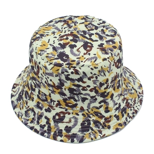 Close-up of abstract leopard print fabric on a stylish reversible canvas bucket hat