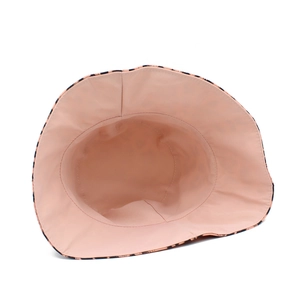 Detail of pink cotton sun hat featuring leopard print brim and interior stitching quality
