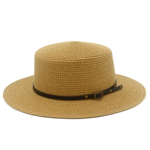 Detailed texture of woven straw boater hat with a brown leather strap and metal buckle