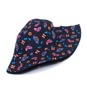 Double-sided sun bucket hat with colorful butterfly and flower prints on navy blue fabric