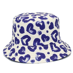 White bucket hat with all-over blue heart pattern and stylish wide brim for women