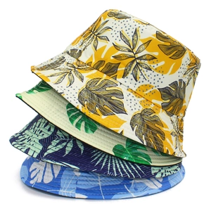 Tropical banana leaf print reversible bucket hats for men and women in four assorted colors