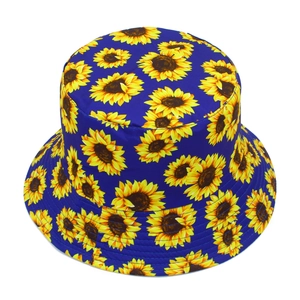 Close-up of yellow sunflower pattern and stitching on a navy blue bucket sun hat