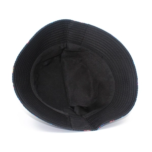 Detail of reversible bucket hat showing black inner lining and reinforced stitched brim
