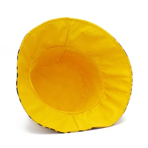 Detailed view of the yellow cotton canvas lining and stitching of the sun hat