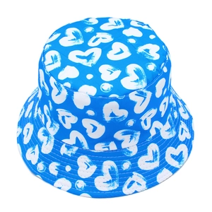 Detail of blue bucket hat featuring white heart pattern and reinforced brim stitching