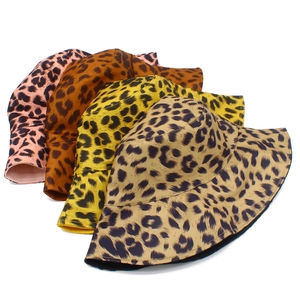 Detail view of foldable leopard print bucket hats in four various vibrant color options