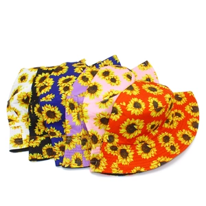 Close-up of reversible bucket hats with sunflower prints in six vibrant colors