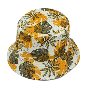 Close-up of tropical palm leaf pattern and stitching details on a summer bucket hat