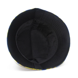Detail view of black reversible bucket hat inner fabric with reinforced stitching and brim