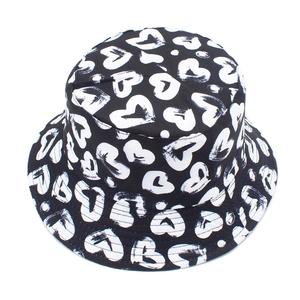 Close-up of heart print bucket hat with ABC embroidery detail on the brim