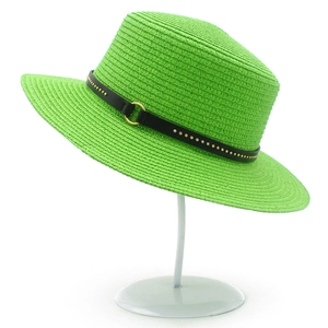 Vibrant green straw sun hat with black leather belt and gold rivets for summer style