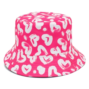 Hot pink bucket hat with white heart pattern prints and decorative reinforced stitching