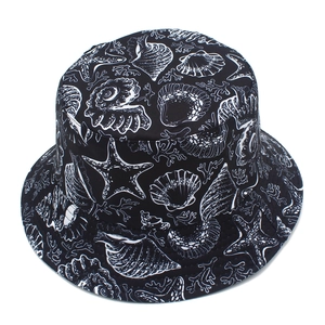 Detail of black canvas bucket hat with white sea life prints like shells and starfish