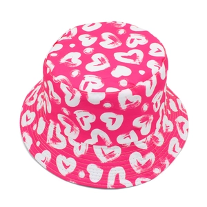 Detail shot of hot pink bucket hat featuring white hand-drawn heart prints and stitching