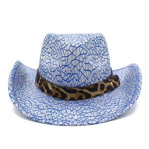 Modern cowboy hat featuring blue geometric crackle texture and leopard print band