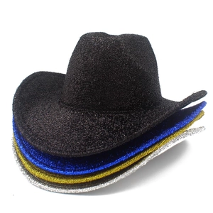 Close-up of sparkling sequin cowboy hats in black, blue, gold, and silver party set