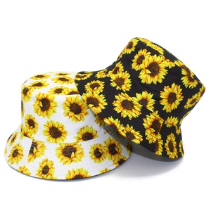 Reversible bucket hat with sunflower print in black and white for sun protection