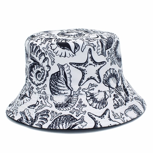 Unisex sun bucket hat featuring black marine life prints on white cotton twill fabric