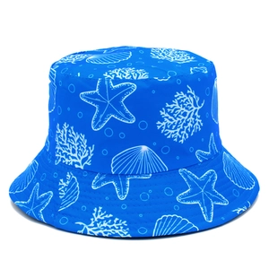 Reversible dark blue bucket hat with white starfish and coral prints for sun protection