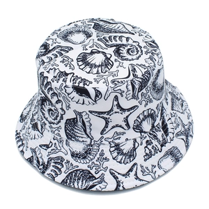 Detail view of cotton bucket hat with black sea shells and starfish marine print