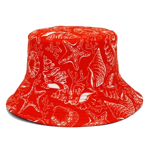 Detail of red bucket hat with white ocean life patterns like starfish and seashells