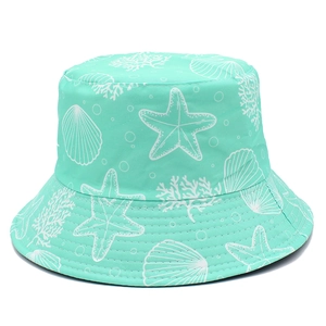 Detail of mint green bucket hat featuring white starfish and shell marine pattern