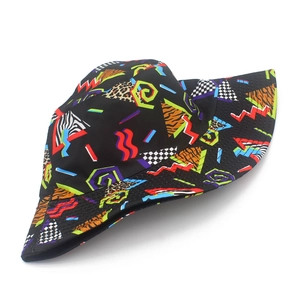 Detailed close-up of retro geometric patterns and animal prints on a stylish bucket hat