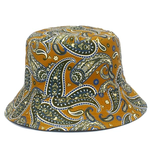 Golden paisley bucket hat with ethnic vintage patterns and sun protection for outdoor fashion