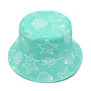 Close-up of mint green sun hat with white starfish and seashell patterns on white background