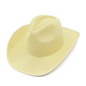 Detail of light yellow straw cowboy hat with fine weaving and curved brim for summer