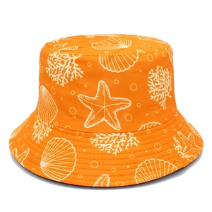 Reversible bright orange bucket hat featuring white starfish and coral ocean patterns