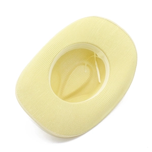 Detail showing the breathable mesh texture and inner sweatband of this light yellow sun hat