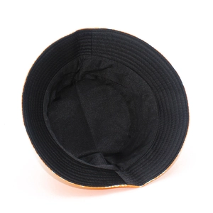 Detail view of the black fabric lining and fine stitching on a reversible bucket hat