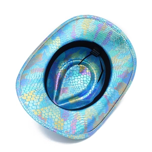 Close-up of holographic blue snakeskin cowboy hat showing the internal material care label