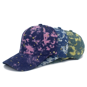 Tie-dye baseball caps with celestial gold star and moon charms in various colors