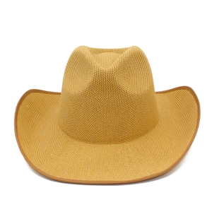 Classic mustard yellow woven cowboy straw hat with curved brim and indented crown