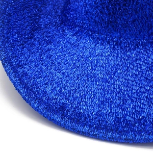 Macro shot of bright royal blue sequined fabric texture on a cowboy hat brim