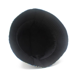 Detailed view of bucket hat interior with paisley pattern and black lining fabric
