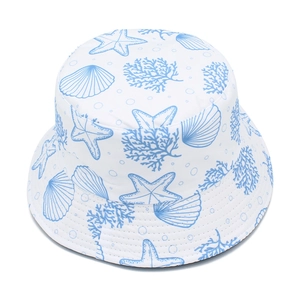 Top view of white bucket hat with light blue starfish, coral and seashell patterns