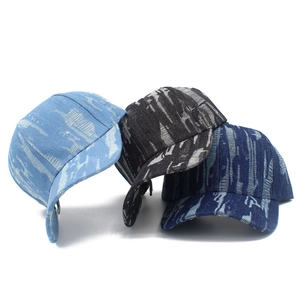 Distressed denim baseball caps in light blue, black, and dark blue with ripped details