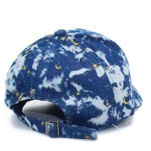Detail view of denim tie-dye baseball cap featuring back adjustable strap and metal buckle