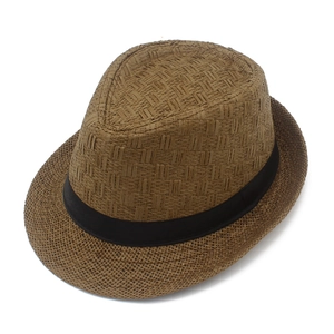 Detail of dark brown straw fedora featuring a tight weave pattern and black ribbon band