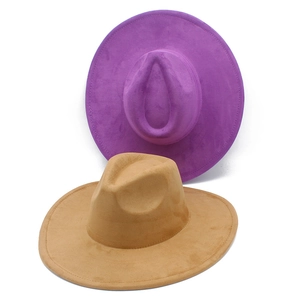 Detail of wide brim suede fedora hats in purple and camel with reinforced stitching