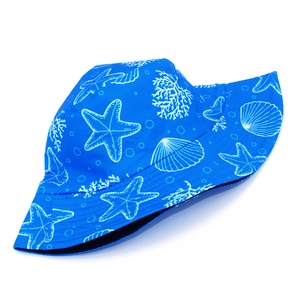 Detailed close-up of blue sun hat featuring sea star prints and reinforced brim stitching